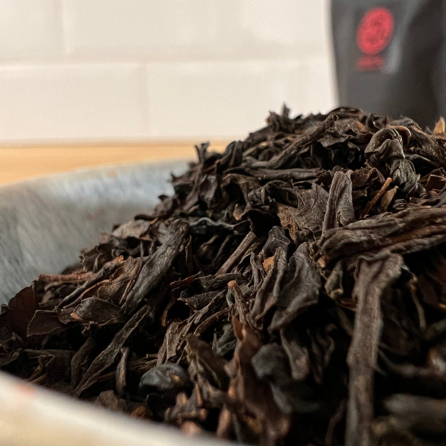 Close-up of cherry flavoured tea leaves in a bowl with a blurred background