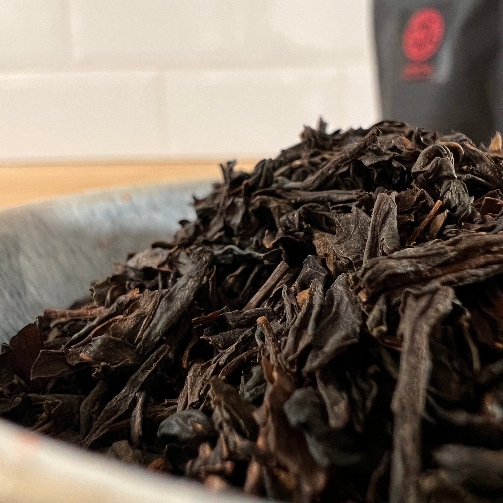 Close-up of cherry flavoured tea leaves in a bowl with a blurred background