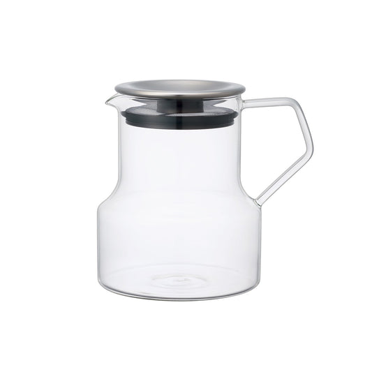 Clear glass teapot with a metal lid on a white background