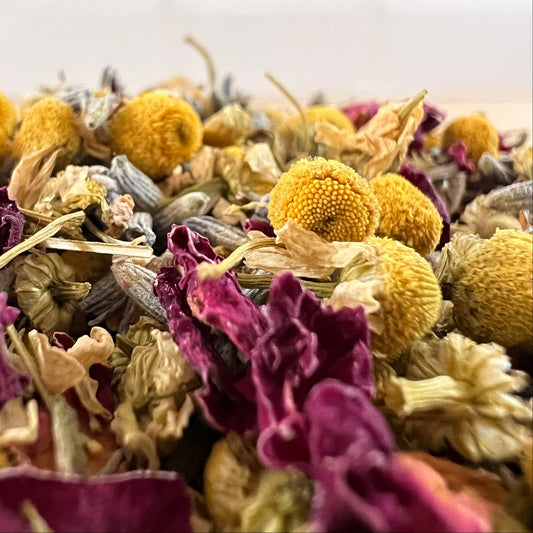 Close-up of rose petals, lavender and chamomile with a soft focus background