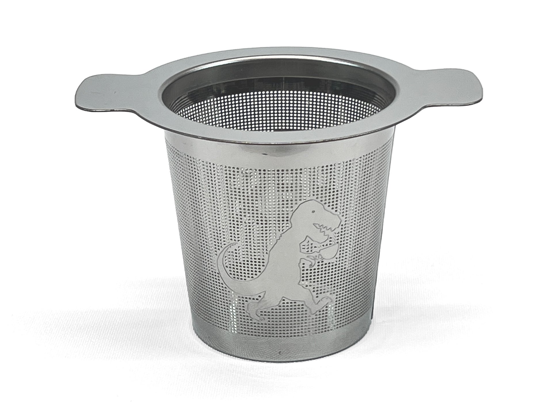 Front view of a stainless steel tea infuser with a T-Rex holding a cup of tea on it