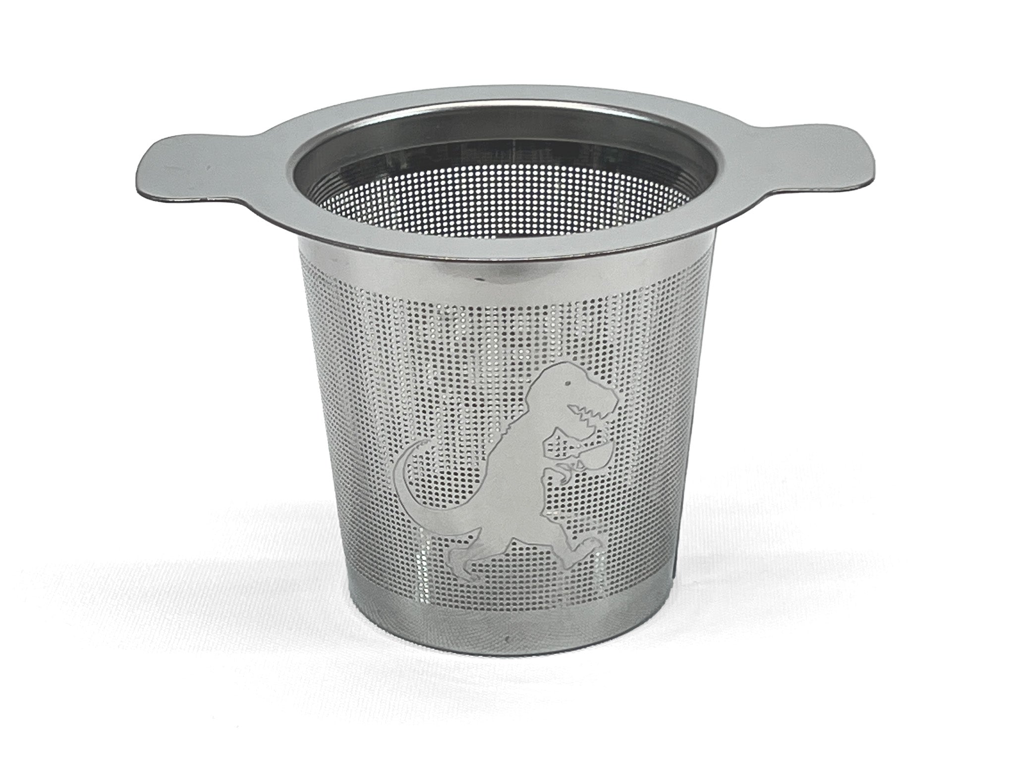 Front view of a stainless steel tea infuser with a T-Rex holding a cup of tea on it