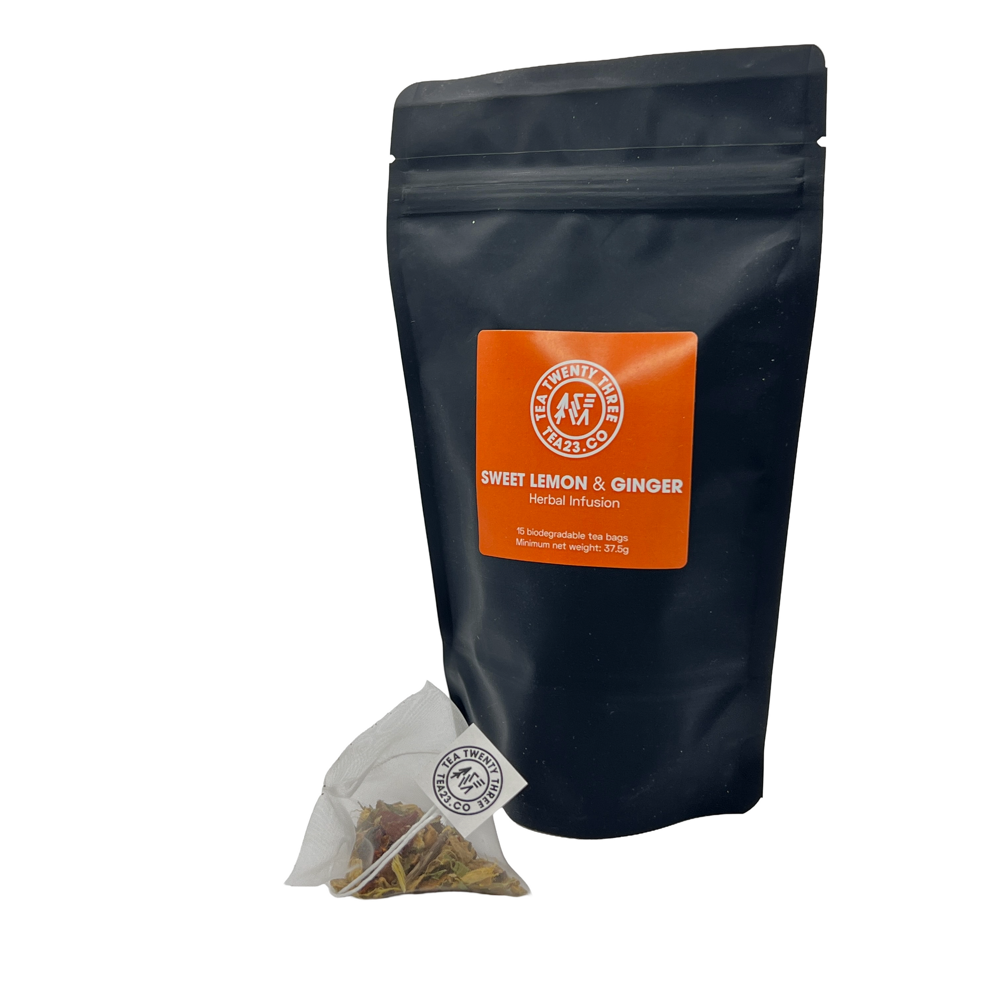 A sweet lemon and ginger tea bag next to a pouch of lemon and ginger tea bags