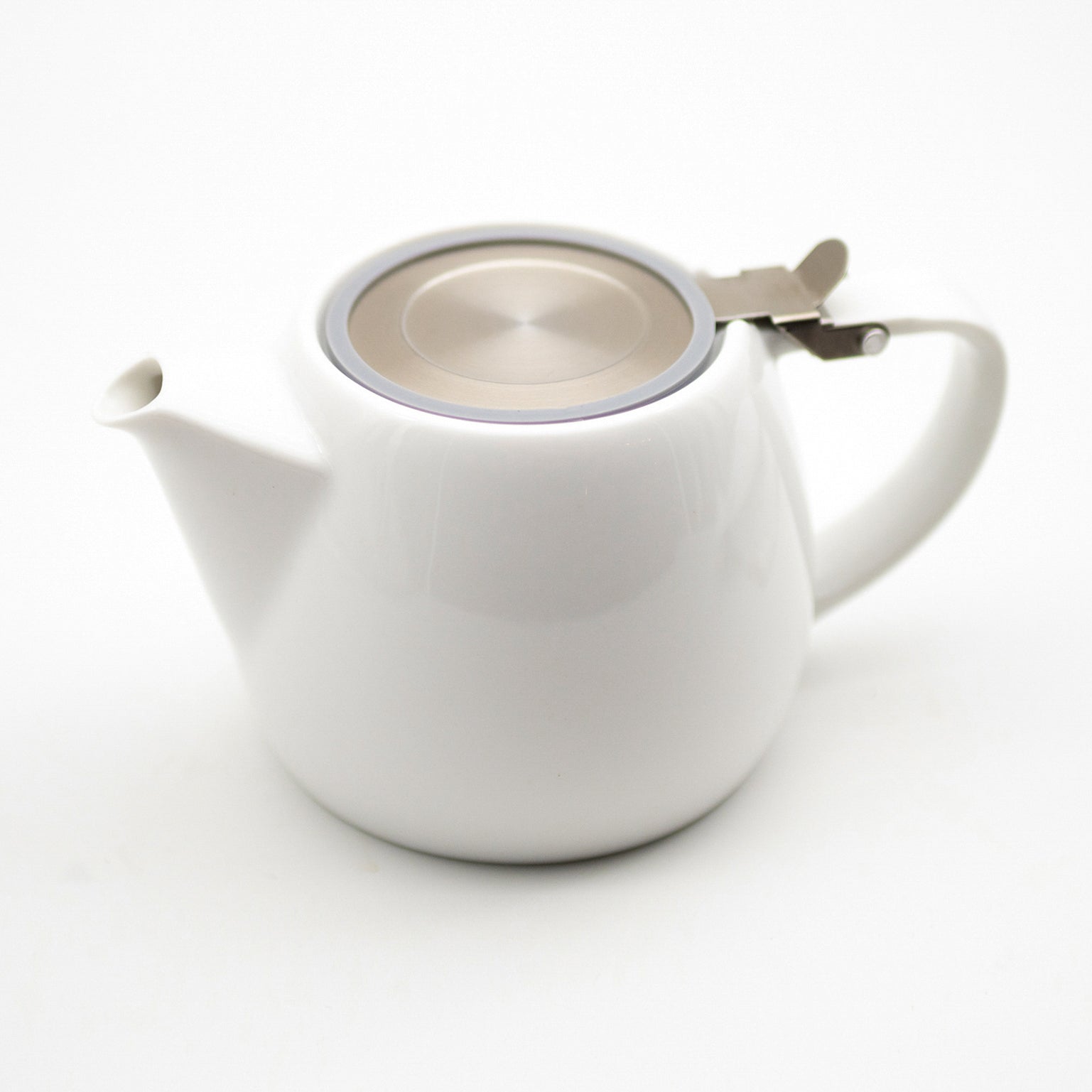 A close up of a white porcelain tea pot and stainless steel infuser. Shop the range of TEA23 tea accessories, gadgets, and TEA23 merchandise