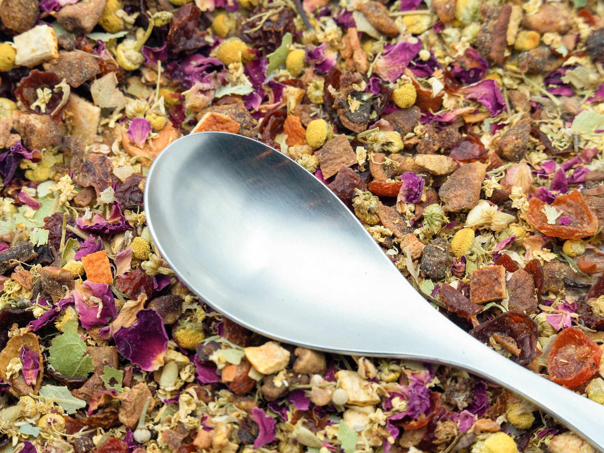 Chamomile + Pear loose fruit tea from TEA23 with a spoon resting on top