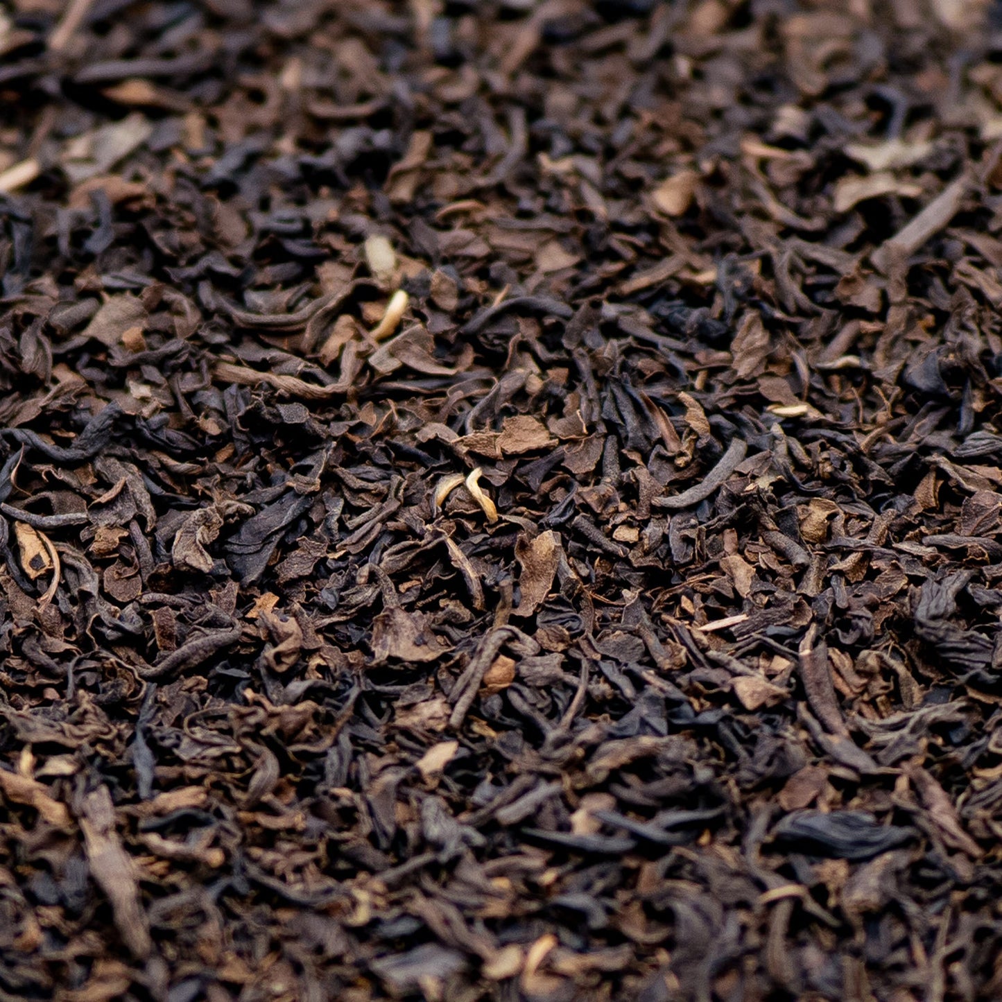 A pile of decaffeinated Assam loose leaf black tea 