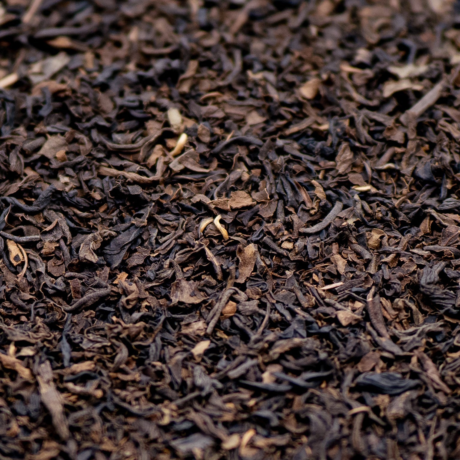A pile of decaffeinated Assam loose leaf black tea 