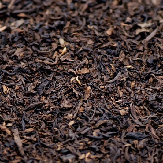 A pile of decaffeinated Assam loose leaf black tea 