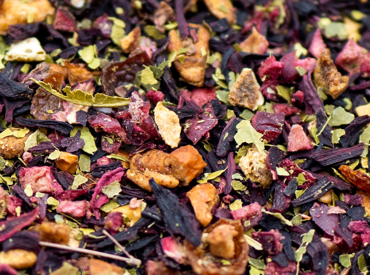 A close up of loose Slamming Orange fruit tea from TEA23