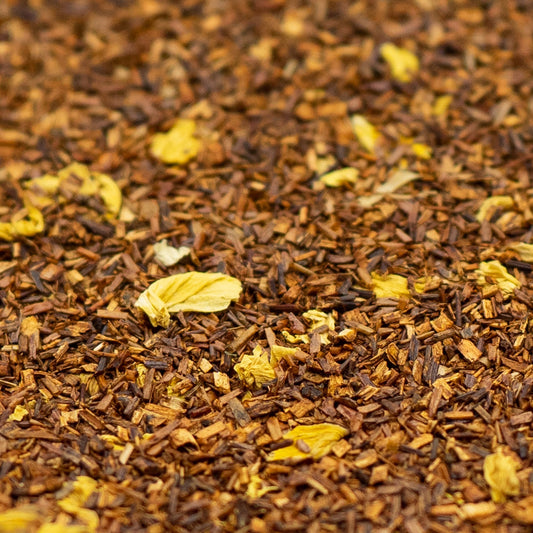 Pile of Rooibos tea with sunflower petals