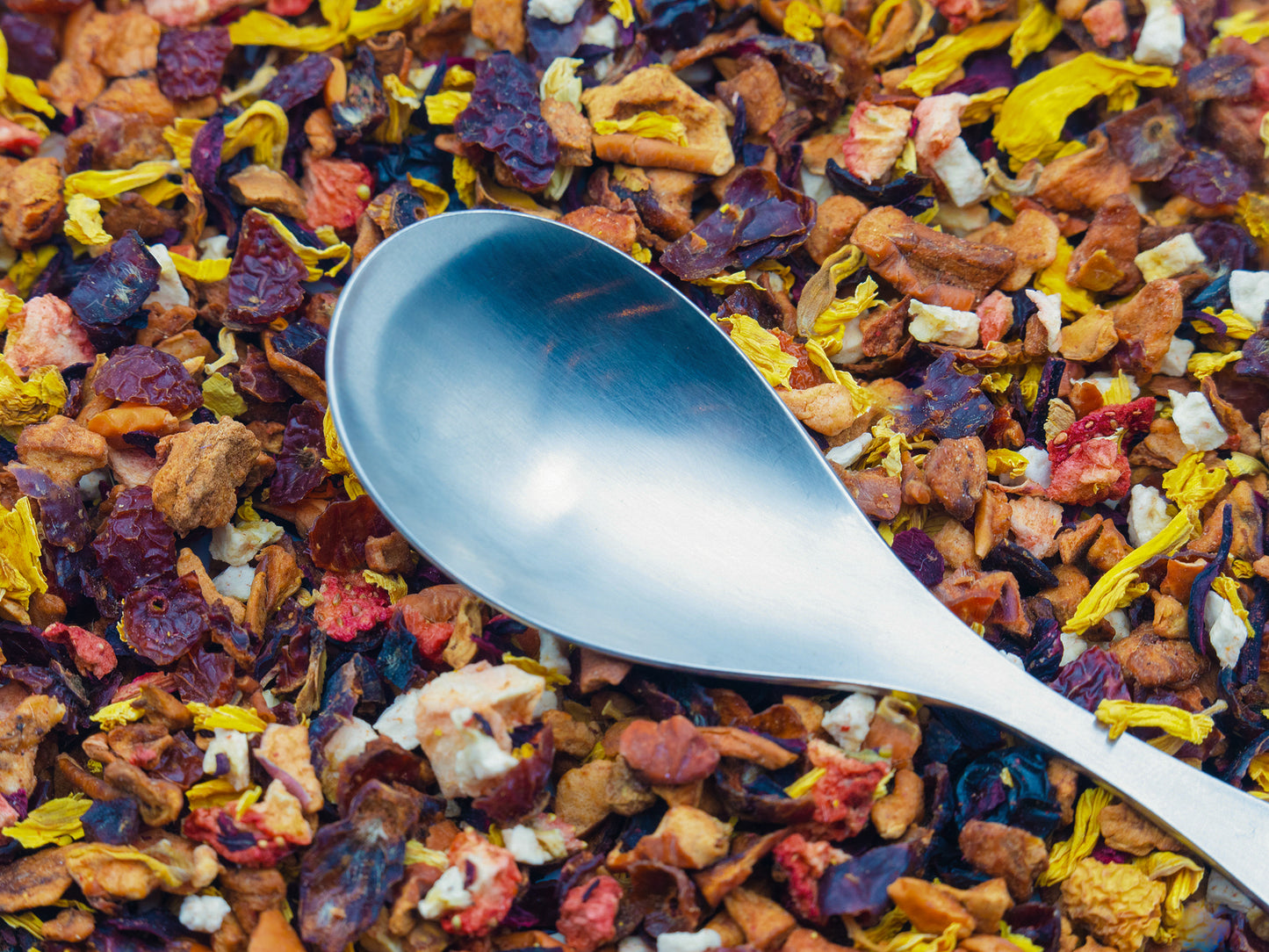 TEA23 Banana Berry loose fruit tea with a spoon on top